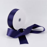 Purple satin ribbon spool on white background, decorative gift ribbon roll