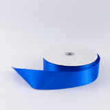 Blue satin ribbon roll on white background