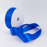 Blue satin ribbon roll with loose ribbon on white background