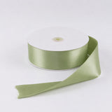 Light green satin ribbon roll on white background