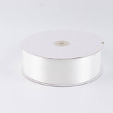 White satin ribbon spool on a plain background#whtbkgd