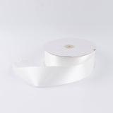 White satin ribbon spool on a white background