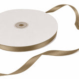Ivory and gold satin ribbon spool isolated on white background#whtbkgd
