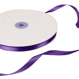 Purple satin ribbon spool on white background#whtbkgd