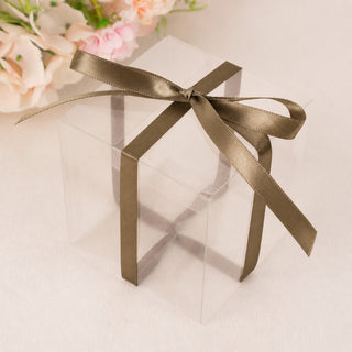 Transparent gift box with gold ribbon and floral background