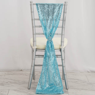 Turquoise sequin chair sash draped elegantly on a silver chiavari chair