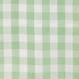 Green and white checkered tablecloth on a dining table setting #whtbkgd