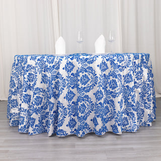 Add Elegance to Your Event with the 120" Royal Blue Seamless Round Velvet Flocking Design Taffeta Damask Tablecloth