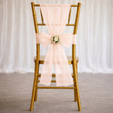 Gold Chiavari chair with blush pink wedding sash and floral accent