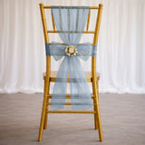 Gold Chiavari chair with light blue tulle bow and floral centerpiece