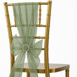 Gold Chiavari chair with sage green sheer bow and pearl embellishment
