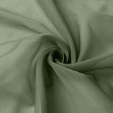 Soft sage green fabric with elegant swirl folds, close-up texture.#whtbkgd