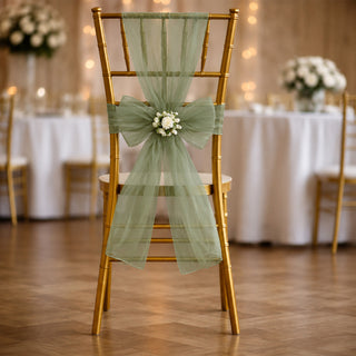 Gold Chiavari chair with sage green tulle and floral wedding decor