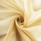 Sheer golden fabric in a swirling pattern. #whtbkgd