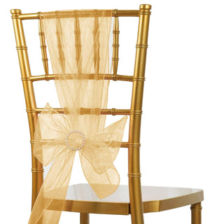 Gold chiavari chair with elegant sheer gold sash and bow.