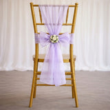 Gold Chiavari chair with lavender tulle and floral wedding bow décor