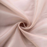 Soft pink fabric draped in swirling folds, showcasing delicate texture. #whtbkgd