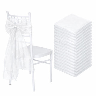 White chair with a sheer white sash and a stack of white napkins