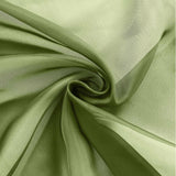 Green sheer fabric swirl, showcasing its lightweight texture and flow. #whtbkgd