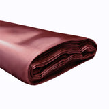 Burgundy satin fabric with a smooth, shiny surface. #whtbkgd