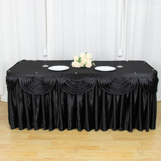 Create a Regal Atmosphere with the 21ft Black Pleated Satin Double Drape Table Skirt