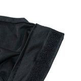 Close-up of black elastic fabric seam and Velcro edge