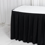 Black box pleated bed skirt with white mattress in minimalist bedroom