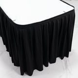 Black pleated table skirt for banquet and event tables, round corner design
