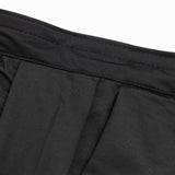 Close-up of black ribbed fabric waistband with stitched seams