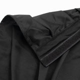 Black fabric garment close-up with Velcro cuff detail