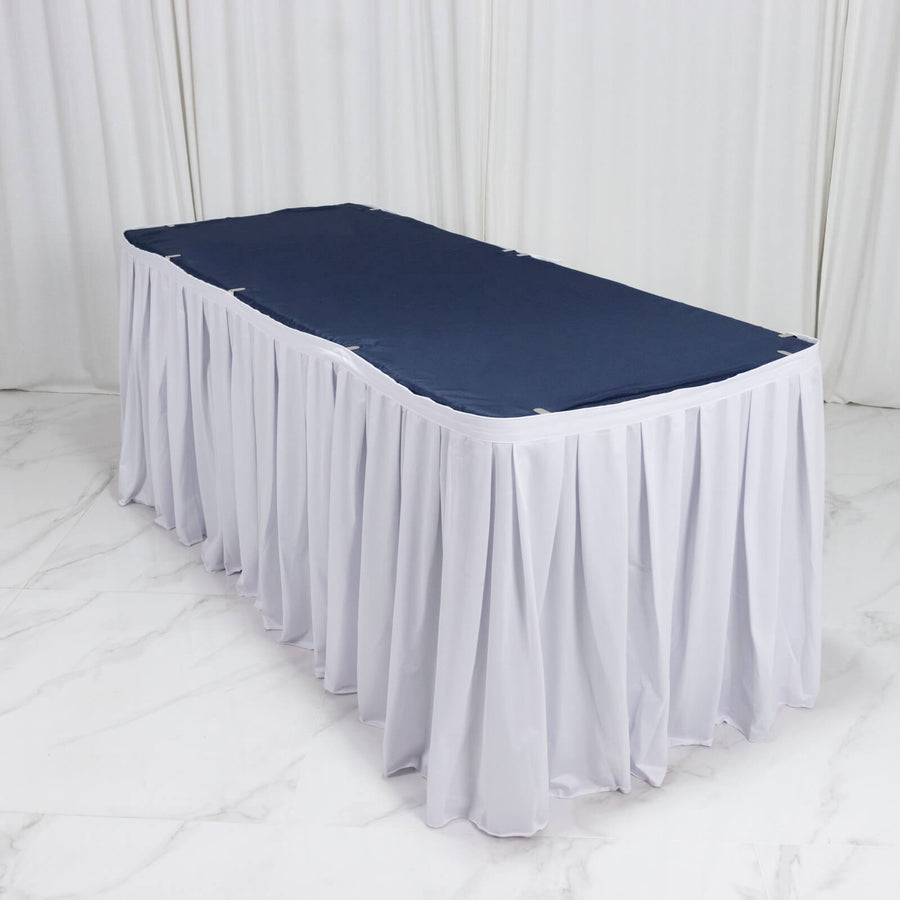 White banquet table skirt with navy tabletop cover on event table