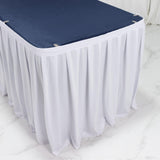 White table skirt with navy tabletop cover for event decor