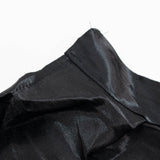 Close-up of black fabric garment seam on white background