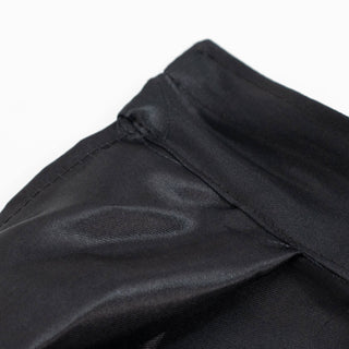 Close-up of black quilted fabric with stitched seam texture#whtbkgd