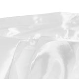 Soft white satin fabric texture close-up with elegant folds