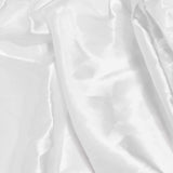 Close-up of white wrinkled fabric texture background