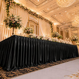 Elegant wedding reception table with floral arrangements in a luxury ballroom