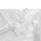 White satin fabric close-up with soft folds and delicate texture
