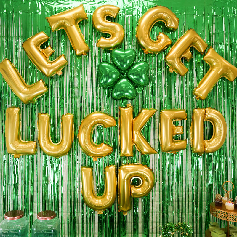 St. Patrick's Day dessert table with gold balloons