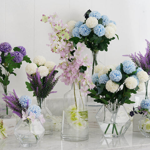 Pastel floral tablescape with vases and lavender napkins