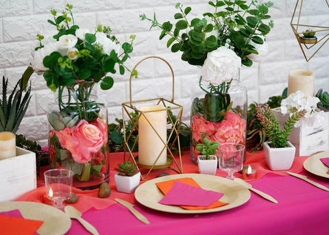 Succulent table centerpiece with candles and place settings