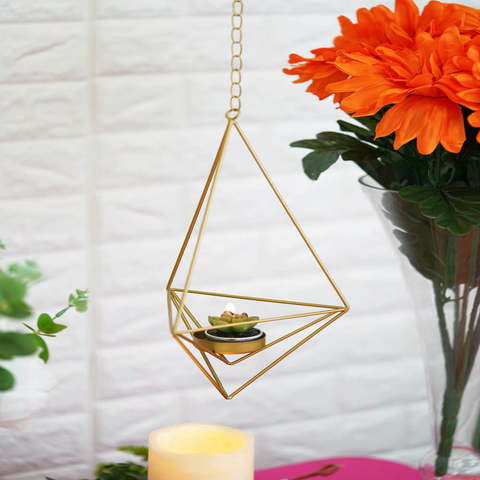 Hanging geometric candle holder with small succulent
