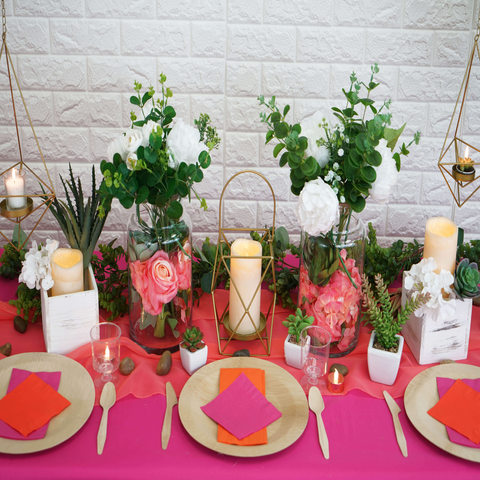 Succulent table centerpiece with candles and floral jars