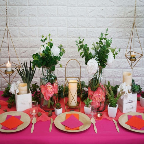 Festive succulent table setting with pink tablecloth