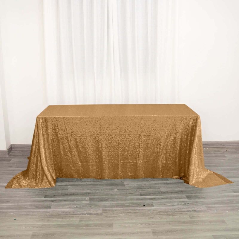 Gold sequin tablecloth on rectangular table