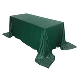 Green sequin tablecloth draping over a rectangular table