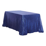 Blue sequined tablecloth on a table, perfect for events and decorations.