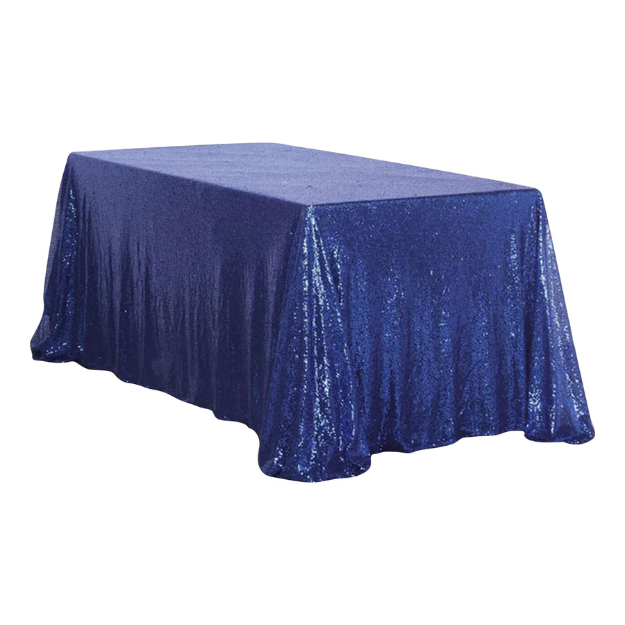 Blue sequined tablecloth on a table, perfect for events and decorations.
