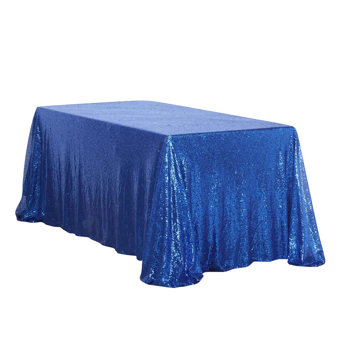 Blue sequin tablecloth draped over a rectangular table.