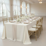 Elegant dining table set with flowers and candles in a sophisticated venue.
